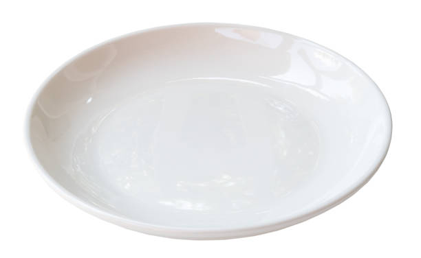 istock Single white ceramic plate isolated on white background with clipping path Close up photo 1696517663