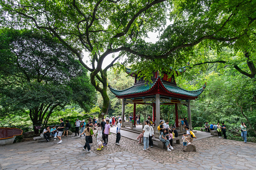 Changsha, China - August 29, 2023 : People visiting Autumn-Admiring Pavilion or Aiwan Pavilion, a Chinese pavilion on Mount Yuelu, in Yuelu District