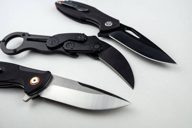 istock Three tactical combat knives isolated on white 1696624066