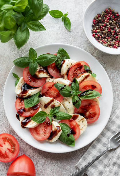 istock Caprese salad with tomatoes, mozzarella and basil. 1696629129