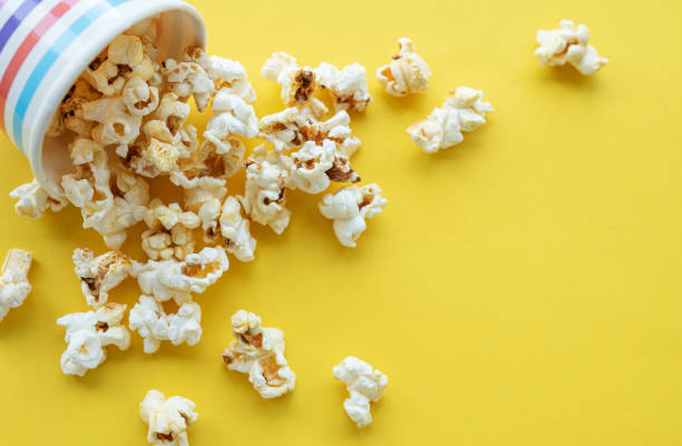 istock Popcorn bucket on yellow background 1696633830