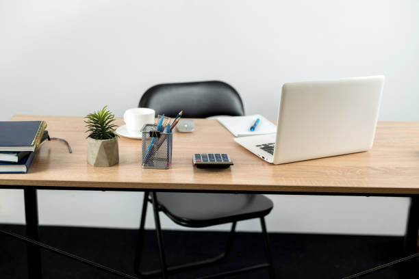 istock Desk for study work or freelance with note pad pen and laptop 1696647128