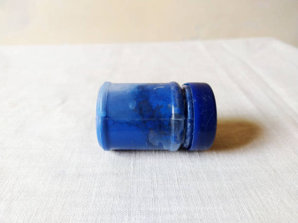 istock Bottle of blue paint was open and placed on table 1696689269
