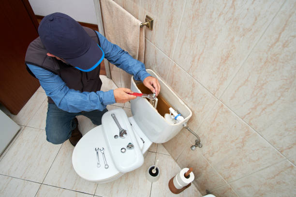 istock Plumber repairing a toilet cistern 1696692510