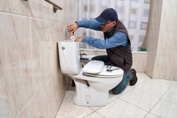 istock Plumber repairing a toilet cistern 1696692523