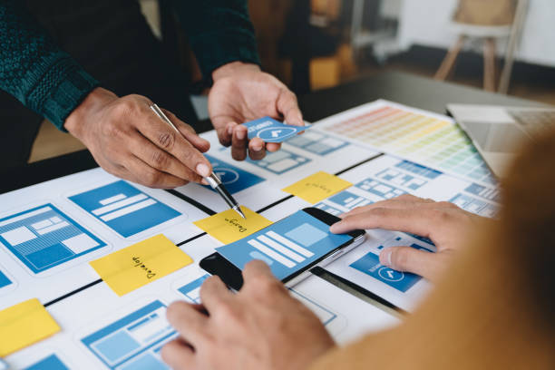 istock A group of Asian UI developers, designers, and data researchers are brainstorming their projects with laptops, smartphones, and digital tablets. Creative Digital Development Agency. 1696692532