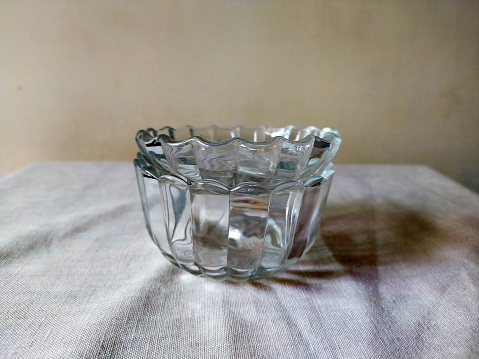 A glass sugar pot with glass cover for serving sugar in it