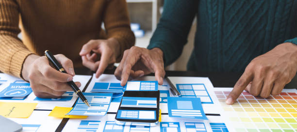 istock A group of Asian UI developers, designers, and data researchers are brainstorming their projects with laptops, smartphones, and digital tablets. Creative Digital Development Agency. 1696697494