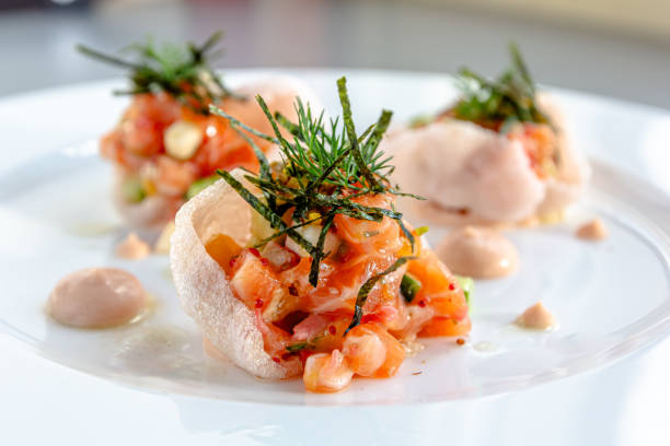 istock Salmon tartare with tomato, red onion, garlic, basil, 1696710099