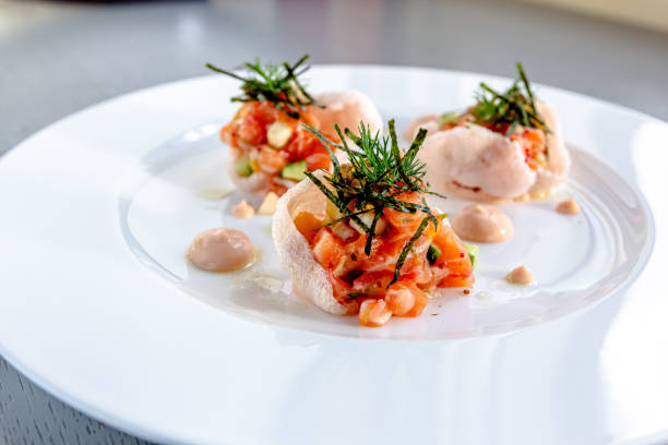 istock Salmon tartare with tomato, red onion, garlic, basil, 1696710107