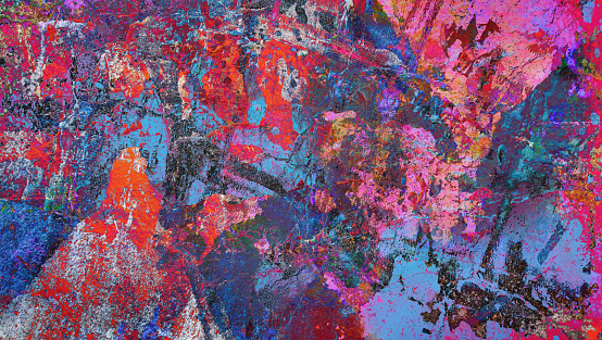 High Resolution old weathered bluish concrete wall detail, coated with multiple layers of white, purple, black, gray, orange, magenta, red, brown, turquoise and other nuances of blue paint colors, applied through the years randomly one on top of the other, cracking and peeling off, run down by the elements, grunge background texture stock photo.