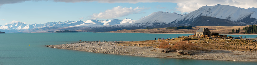 Winter sunlight falls upon the famous Church Of The Good Shepherd on the shores of Lake Tekapo.