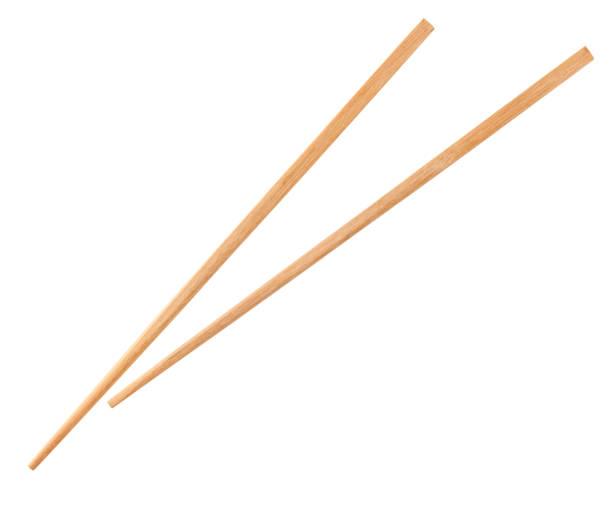 istock Wooden chopsticks isolated on white background. 1696729402