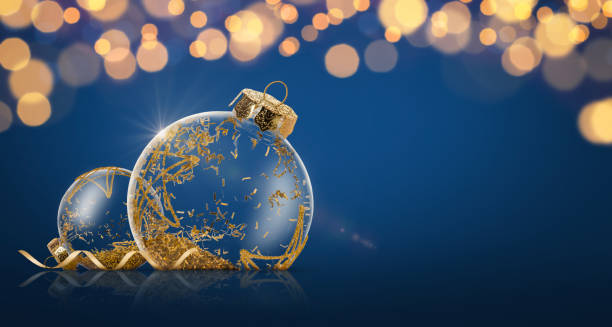 istock Christmas ornament with golden glitters on dark blue background. Copy space 1696735222
