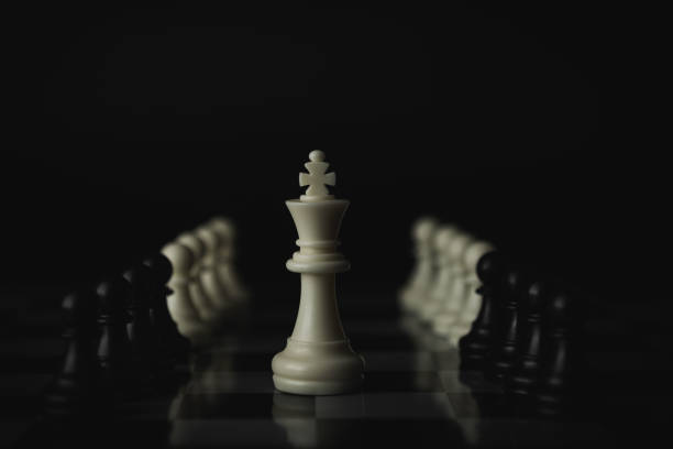 istock Pieces on chess board on black background for playing game and strategy. 1696743105