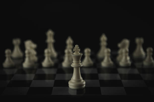 istock Pieces on chess board on black background for playing game and strategy. 1696743628