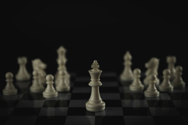 istock Pieces on chess board on black background for playing game and strategy. 1696744955