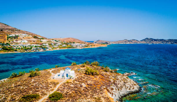 istock Small whitewashed orthodox church by the sea, aerial view 1696757253