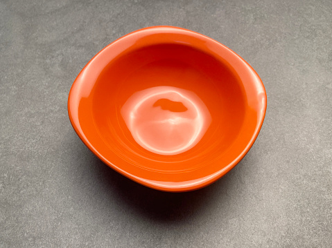 View of a small bowl over a table with a few lentils in the kitchen table