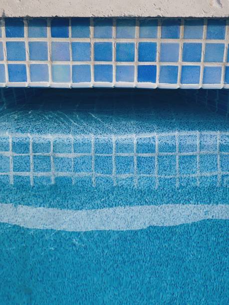 istock Blue square tiles in the pool 1696796911