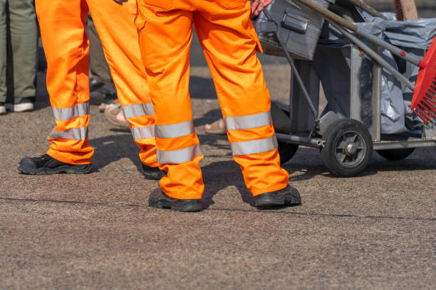 istock Low level view of two persons with working clothes 1696870765