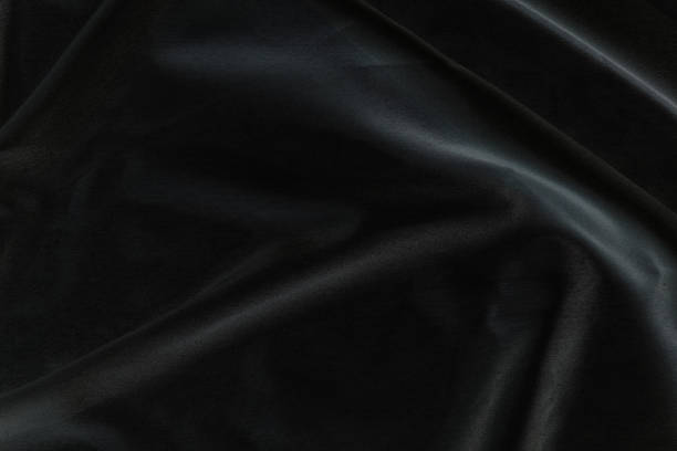 istock Smooth elegant black silk fabric or satin luxury cloth texture for abstract background 1696890761