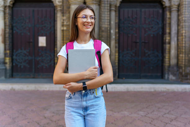 istock University backdrop for notebook-carrying woman 1696896965