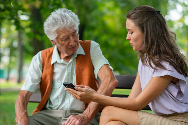 istock Caregiver helping senior diabetic man check his glucose data on smartphone outdoors, in park. 1696981997