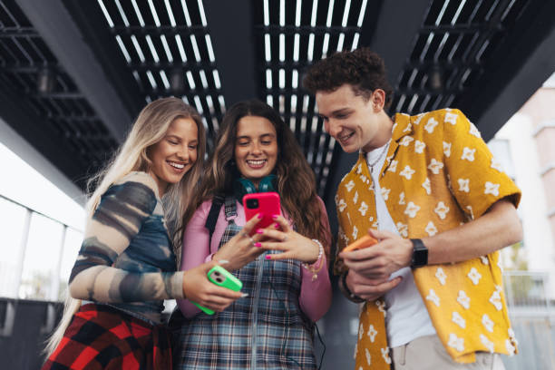 istock Generation z students hanging out together outdoors in the city. 1696993110