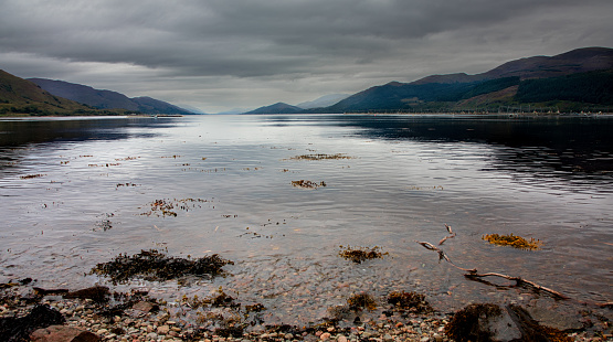 The still waters of Loch Long on a summers day in Scotland, UK.