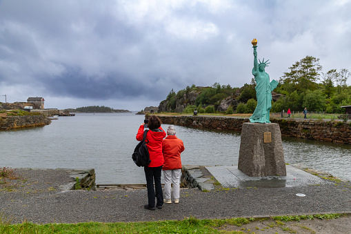Haugesund, Norway - July 17, 2023: A small copy of New York's Statue of Liberty cast from local copper. A gift from the people of France to commemorate the 100th anniversary of U.S. independence.