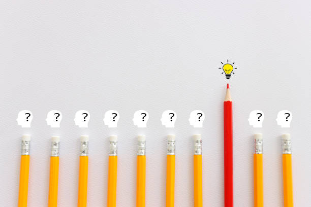 istock bright light bulb and question mark with pencils concept image of 1697088515
