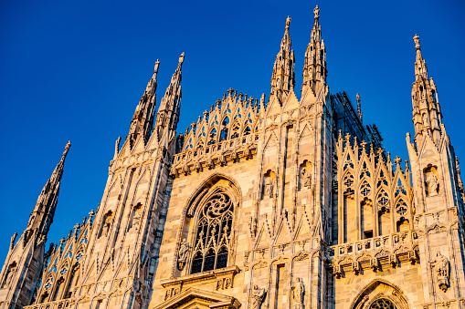 Milan, Italy - 16 August 2019: Milan Cathedral spires on clear blue sky background