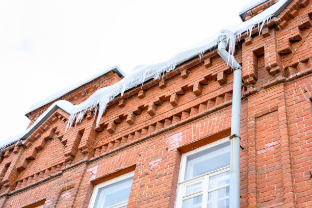 istock Close-up of icicles on the roof. 1697090678