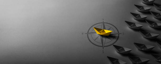 istock Yellow Paper Boat Moving Ahead 1697091309