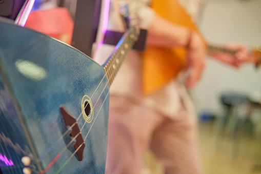 Acoustic Russian balalaika in the music studio. Close-up, selective focus.