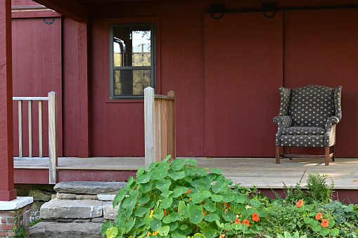 Front view of chair on porch of antique house in Washington, Connecticut, after restoration. It is said that George Washington slept here.