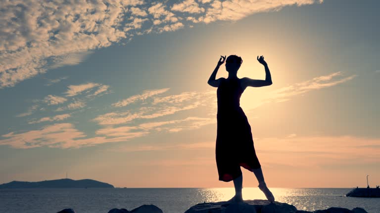 Ballerina dancing on the rocks.