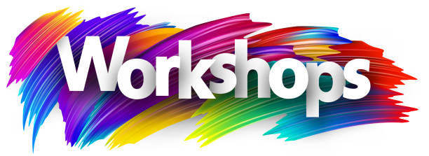 istock Workshops paper word sign with colorful spectrum paint brush strokes over white. 1697139584