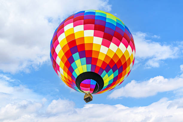istock Hot air balloon flight over blue sky 1697141022