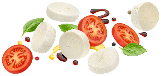 istock Mozzarella and tomato slices with basil and balsamic dressing isolated on white background 1697147945