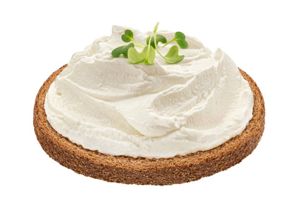 istock Rye bread with cream cheese isolated on white background 1697147958