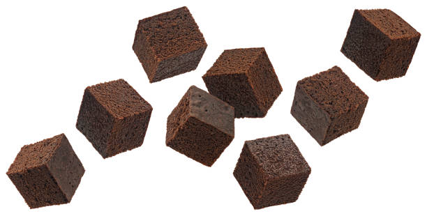 istock Chocolate brownie cubes isolated on white background, full depth of field 1697149679