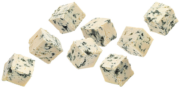 Falling blue cheese cubes isolated on white background with clipping path, full depth of field