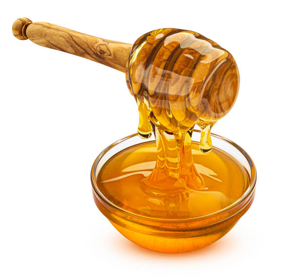istock Honey dipper isolated on white background, full depth of field 1697149729