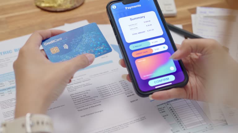 Close up hands woman use smartphone paying  with contactless payment and banking app pay online utility bill payment, Internet banking  technology and money transfer.