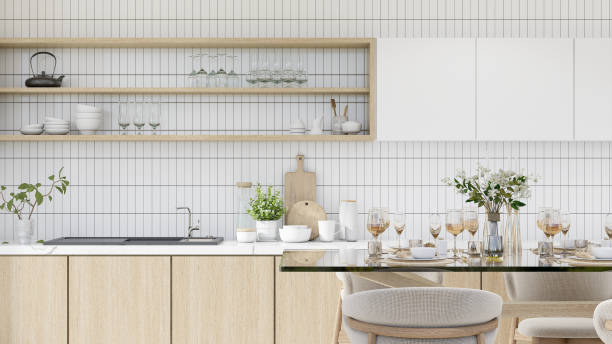 istock Modern kitchen interior, modern minimalist style, large white marble counter top. wooden counter with plates, bowls, ceramics, clear glass, sinks, built-in furniture, wooden cabinets.3D render 1697168160