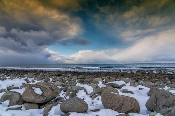 Sunset at Unstad beach, Lofoten islands, Norway in winter
