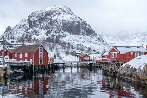 V village of Å in the municipality of Moskenes, in the Lofoten islands in the county of Nordland, Norway in winter. It is snowing.