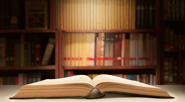 istock opening books in the wisdom library,  bookshelves in school study classroom background 1697201082